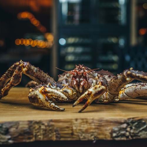crab on wooden chopping board