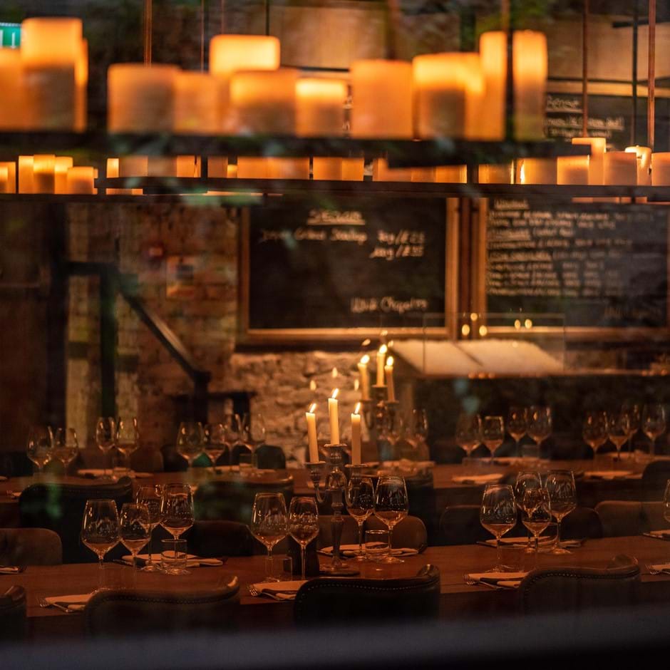 laid table with candles lit