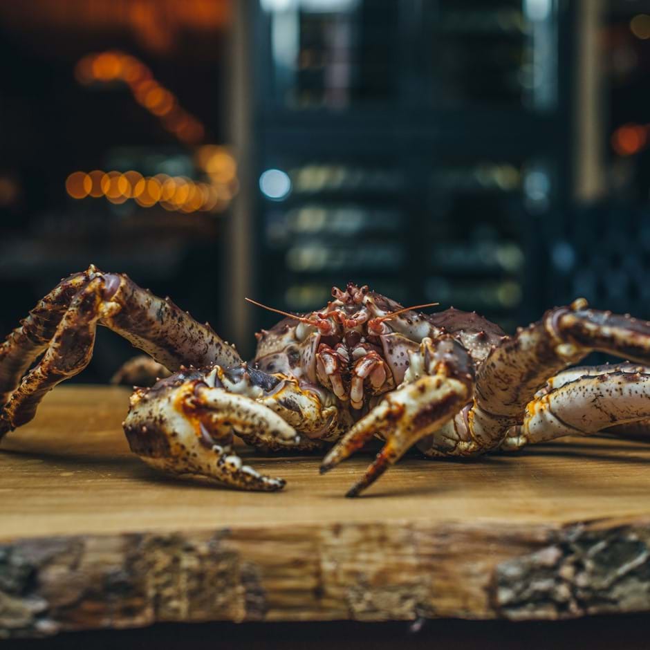 crab on wooden chopping board
